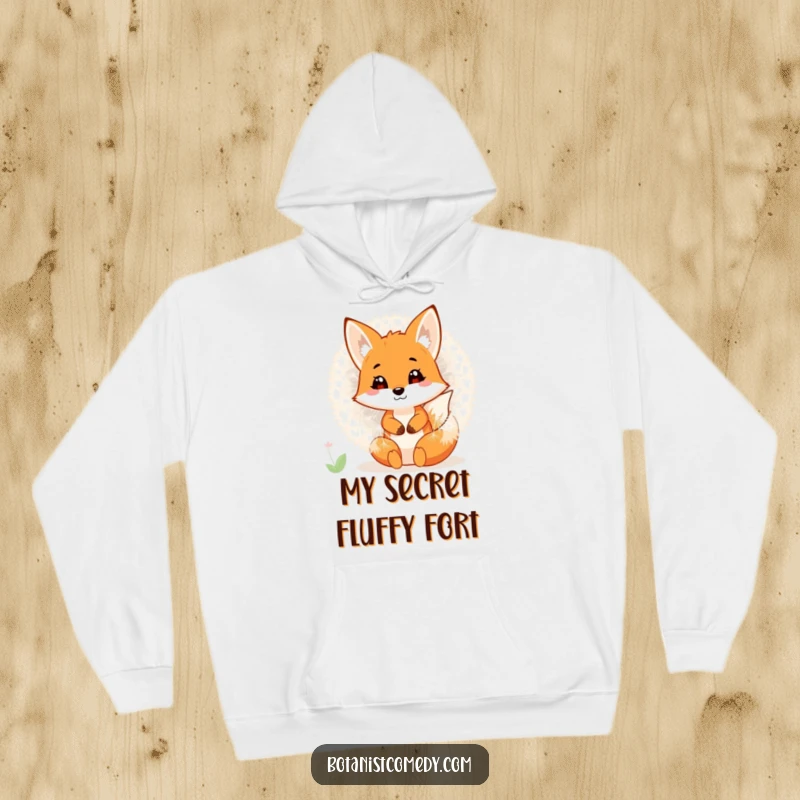 A cozy hoodie featuring a funny fox hiding inside a giant dandelion, offering warmth and whimsical delight.