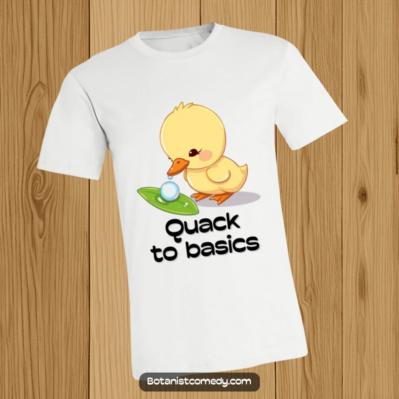 Funny duckling t-shirt displaying a curious duckling character exploring a glistening dewdrop on a vibrant green leaf.