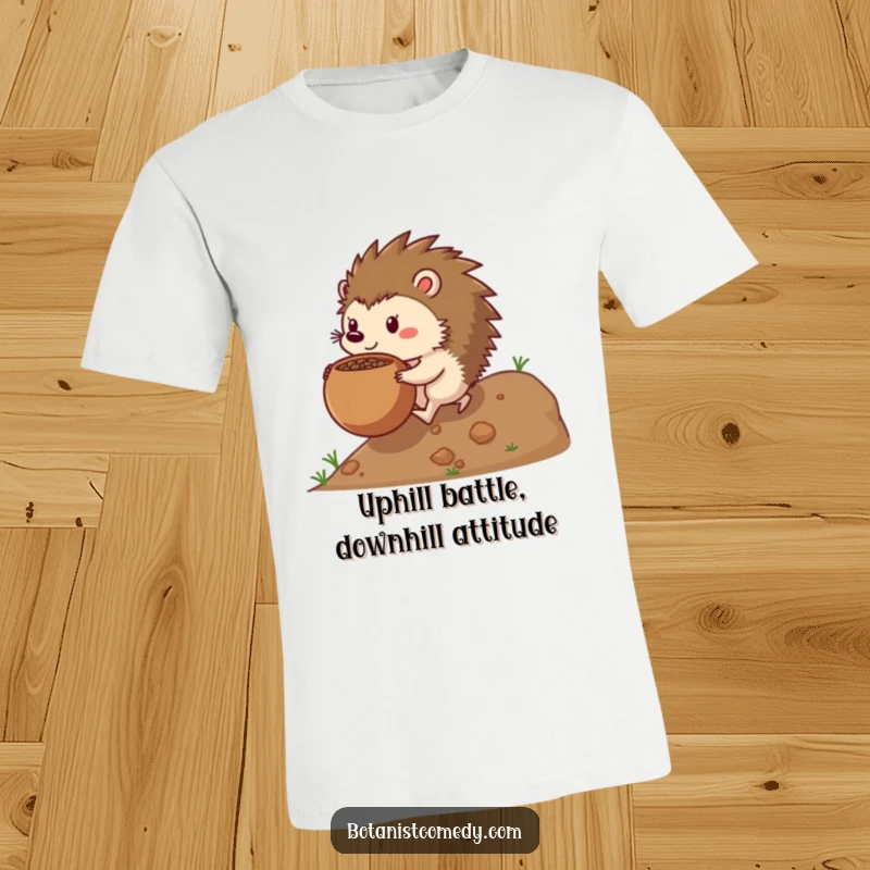 Funny hedgehog t-shirt showcasing a determined hedgehog character pushing a huge seedpot uphill with intense focus.